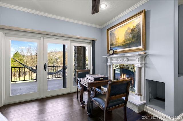 dining space featuring a fireplace, french doors, dark hardwood / wood-style floors, ceiling fan, and ornamental molding