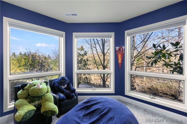 bedroom with baseboards, carpet, and visible vents