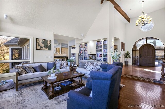 living room with a chandelier and wood-type flooring