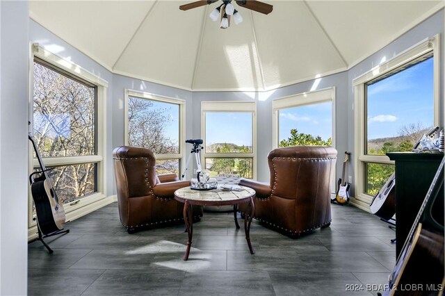 sunroom with high vaulted ceiling and a wealth of natural light