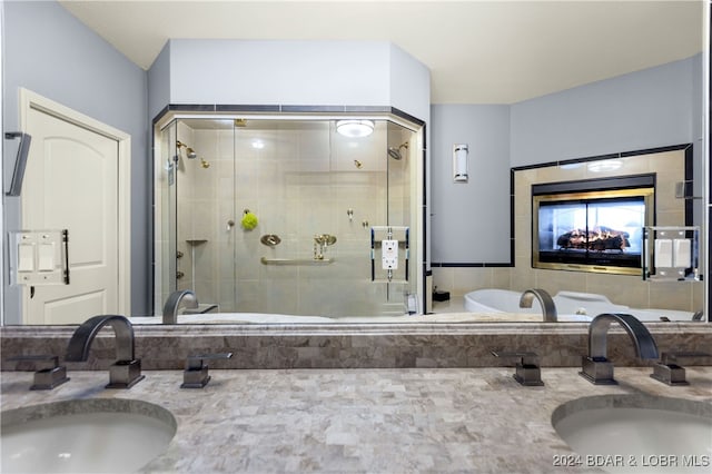 bathroom with an enclosed shower and vanity