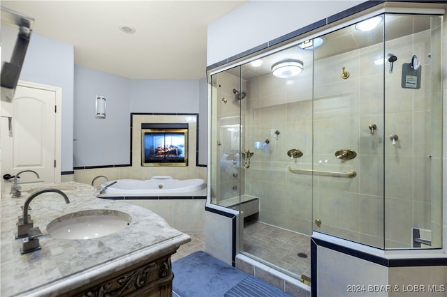 bathroom featuring vanity, separate shower and tub, and tile patterned floors