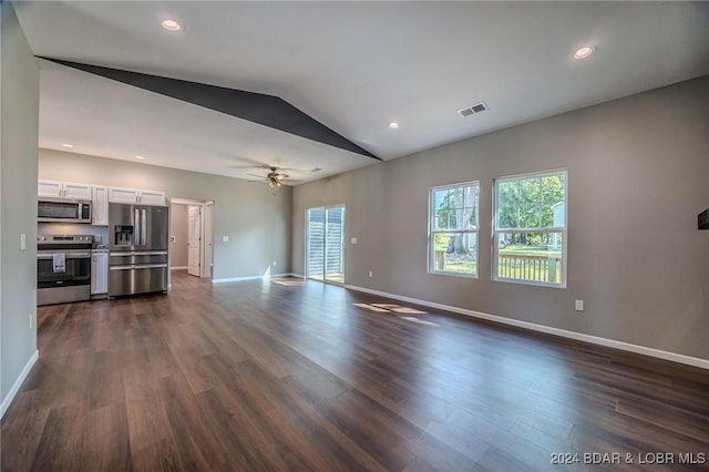 unfurnished living room with dark hardwood / wood-style floors, ceiling fan, lofted ceiling, and a wealth of natural light