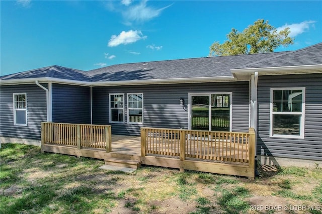 rear view of house with a wooden deck