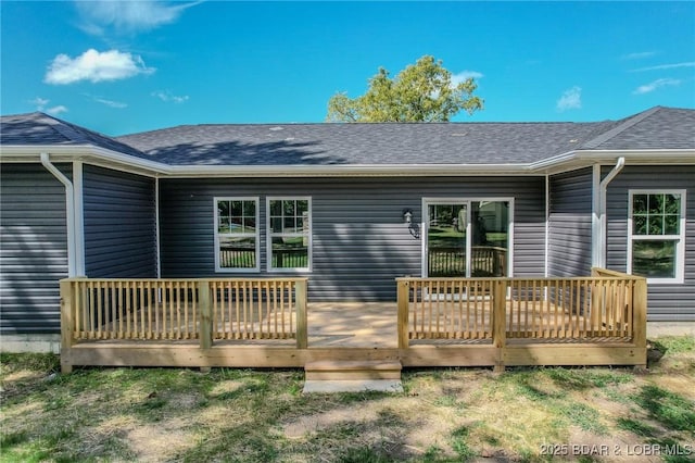 rear view of house with a wooden deck