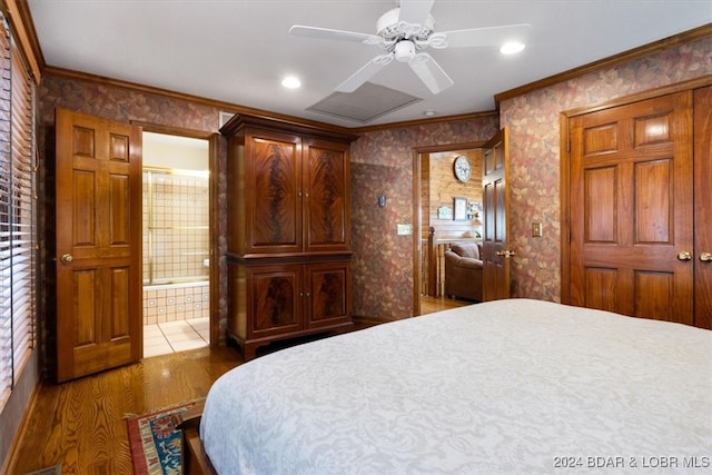 bedroom with wood-type flooring, ensuite bath, crown molding, and ceiling fan