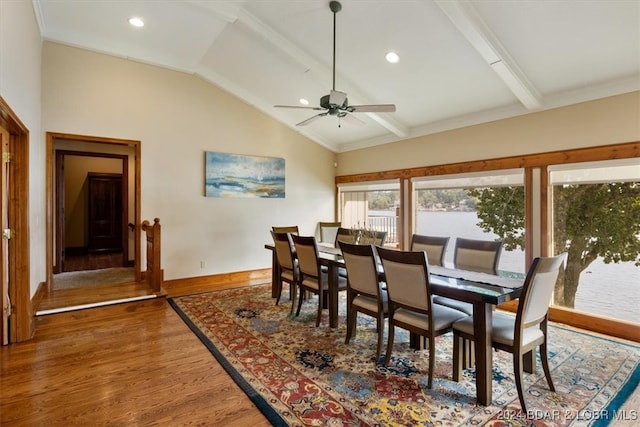 dining area with vaulted ceiling with beams, ceiling fan, and hardwood / wood-style floors