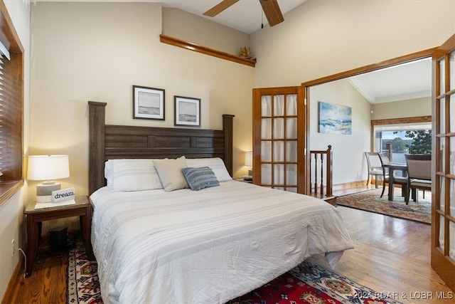 bedroom featuring ceiling fan, hardwood / wood-style flooring, and ornamental molding