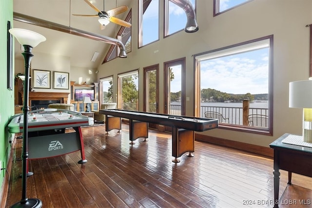 game room with high vaulted ceiling, ceiling fan, beamed ceiling, and hardwood / wood-style flooring