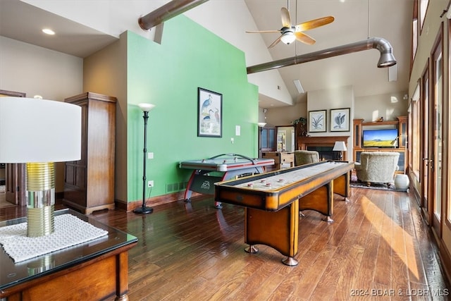 recreation room featuring ceiling fan, hardwood / wood-style floors, and high vaulted ceiling