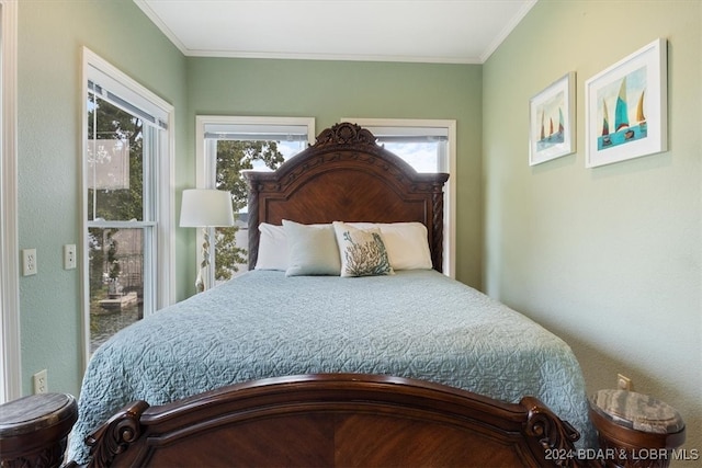 bedroom featuring multiple windows and crown molding