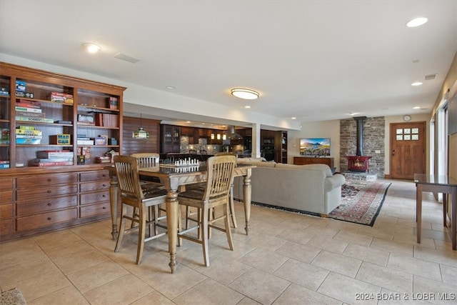 dining area featuring a wood stove