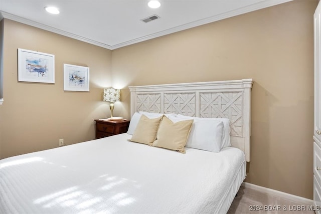 bedroom featuring carpet floors and crown molding