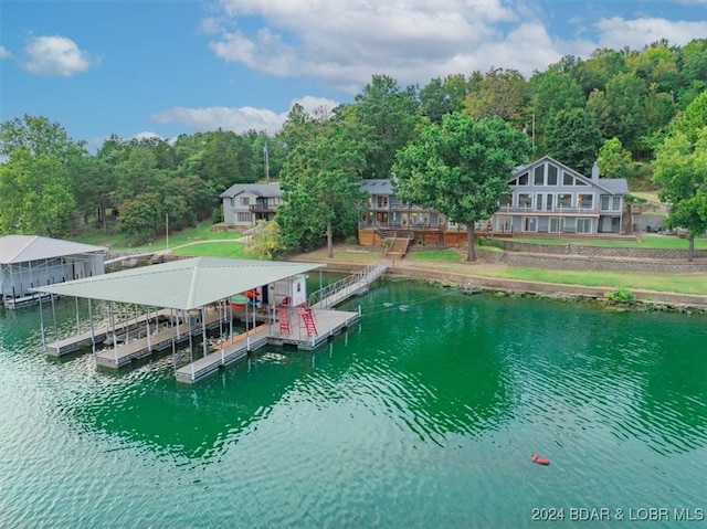 exterior space featuring a boat dock and a water view