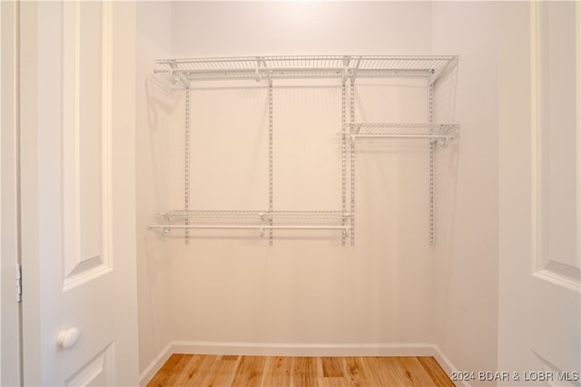 walk in closet featuring hardwood / wood-style floors