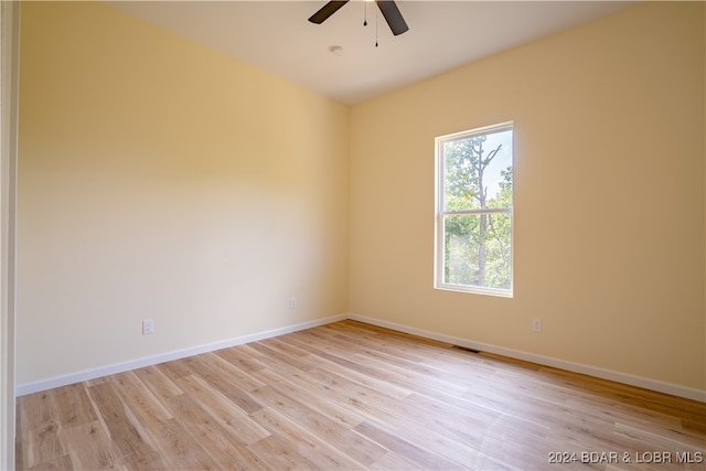 spare room with ceiling fan and light hardwood / wood-style flooring