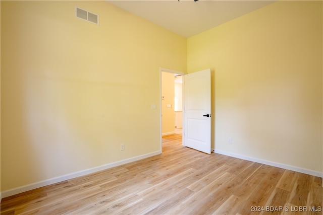 spare room with light wood-type flooring