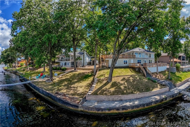 exterior space featuring a water view and a front yard