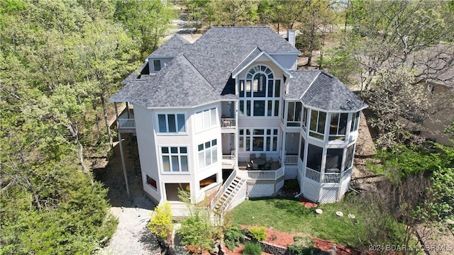 rear view of house with a sunroom