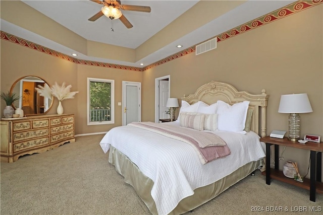 bedroom featuring light colored carpet and ceiling fan