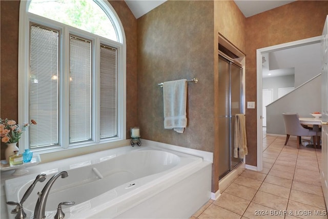 bathroom with tile patterned floors and independent shower and bath