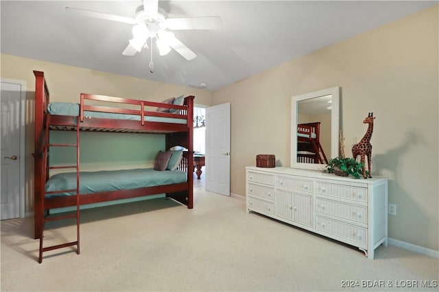 bedroom with light carpet and ceiling fan