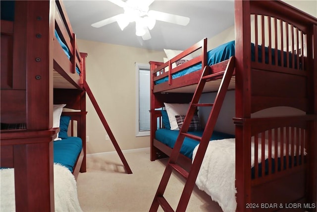 bedroom with ceiling fan and light colored carpet