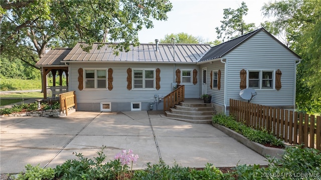 ranch-style home featuring a patio area