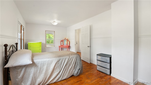 bedroom with wood-type flooring