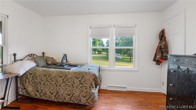 bedroom with hardwood / wood-style floors