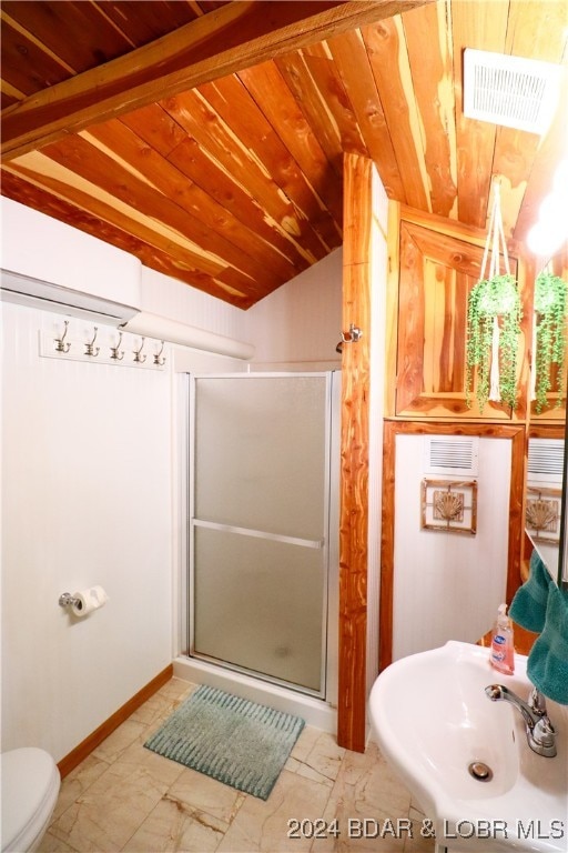 bathroom featuring walk in shower, vaulted ceiling, sink, wooden ceiling, and toilet