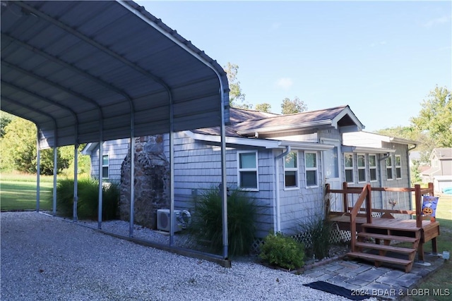 view of vehicle parking featuring a carport