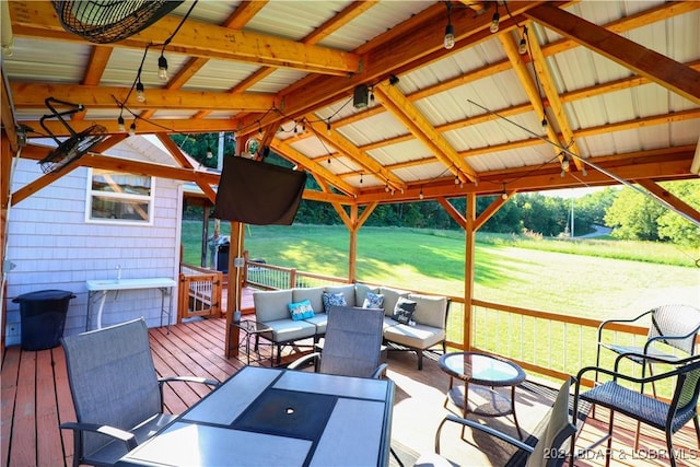 deck with a gazebo, a lawn, and an outdoor hangout area