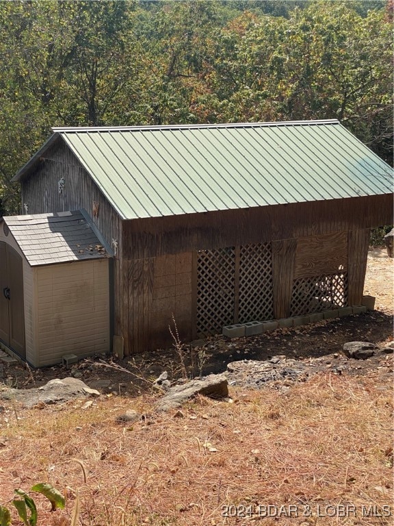 exterior space featuring a storage unit