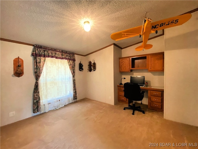 unfurnished office featuring light carpet, vaulted ceiling, a textured ceiling, and built in desk