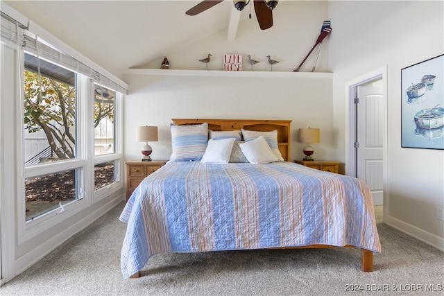 carpeted bedroom with vaulted ceiling and ceiling fan