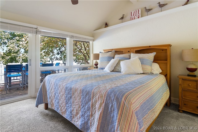 carpeted bedroom with ceiling fan, lofted ceiling, and access to exterior