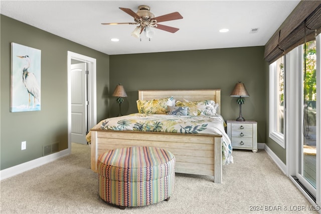 carpeted bedroom featuring ceiling fan and access to exterior