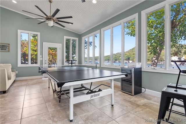 playroom with wooden ceiling, ceiling fan, and plenty of natural light