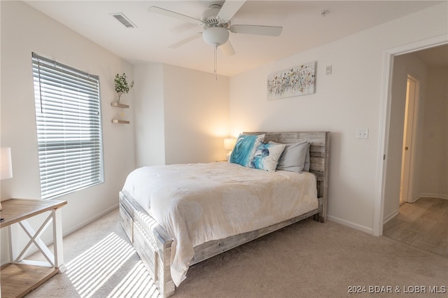 carpeted bedroom featuring ceiling fan