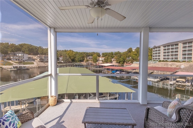 exterior space featuring a water view and ceiling fan