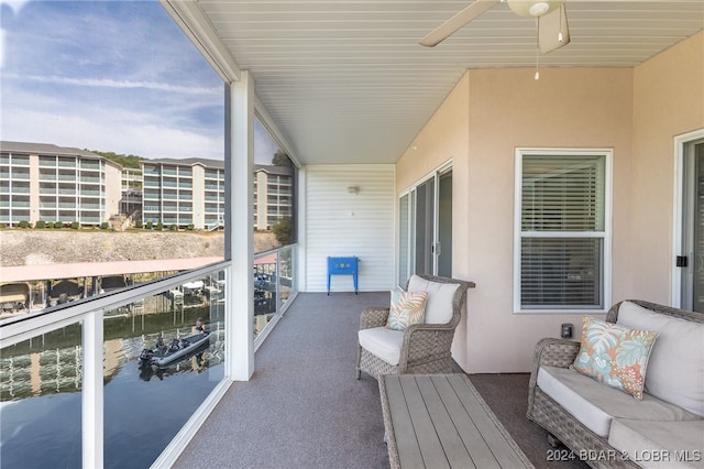 balcony featuring outdoor lounge area and ceiling fan