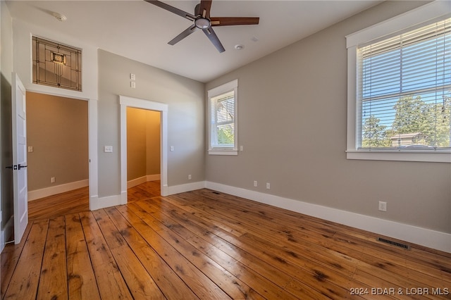 unfurnished bedroom with wood-type flooring and ceiling fan