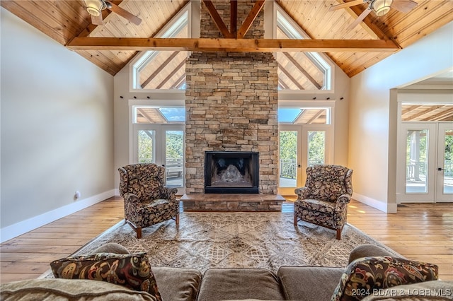 living room featuring ceiling fan, hardwood / wood-style flooring, and a healthy amount of sunlight