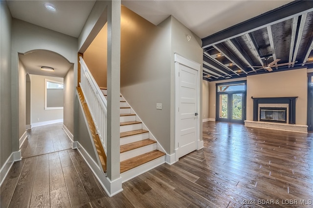 staircase with hardwood / wood-style flooring