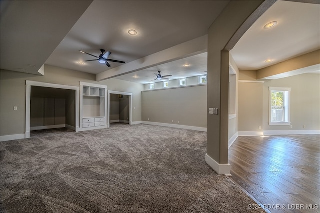 unfurnished living room featuring ceiling fan and hardwood / wood-style flooring