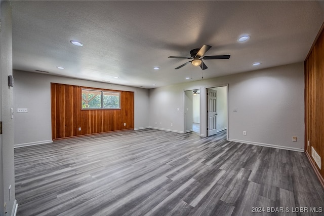 unfurnished room featuring ceiling fan, hardwood / wood-style flooring, and a textured ceiling