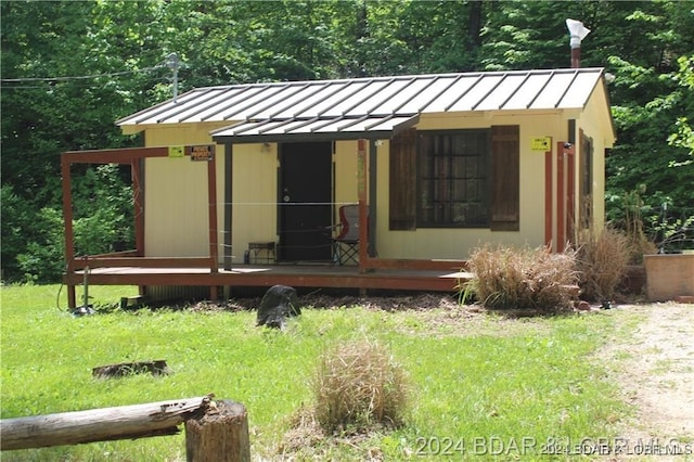 view of outbuilding with a lawn