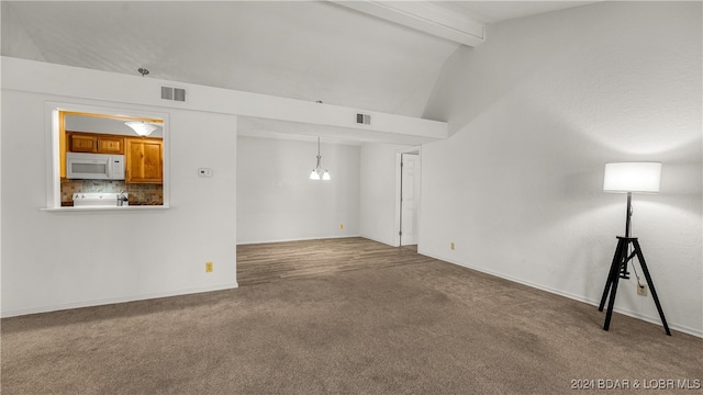 unfurnished living room featuring carpet, lofted ceiling with beams, and an inviting chandelier