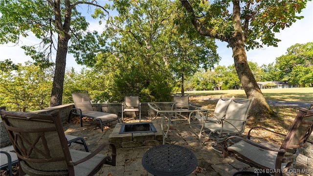 view of patio with a fire pit